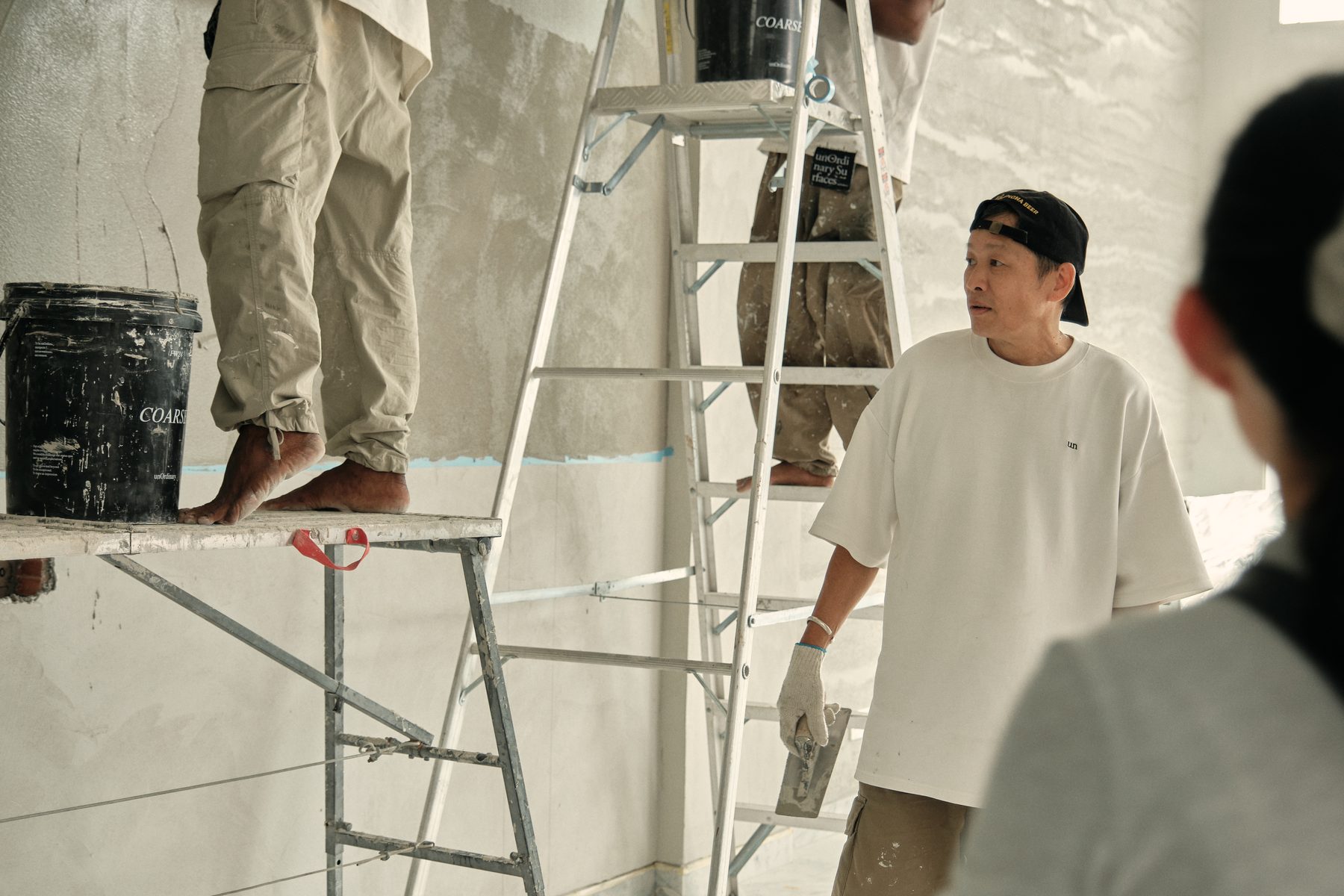 unOrdinary at work — the master craftsman with his team applying a specialist finish