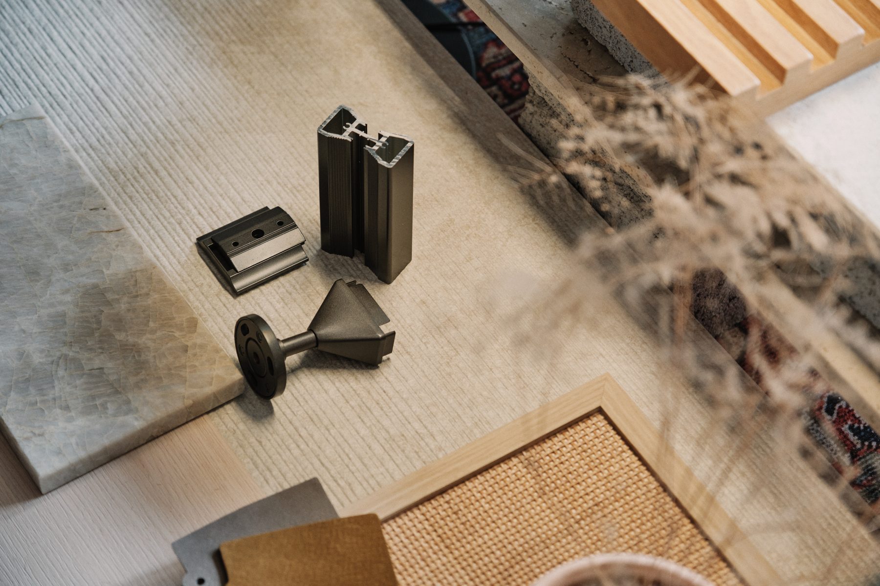 Materials in the hand — samples, hardware, finishes laid out