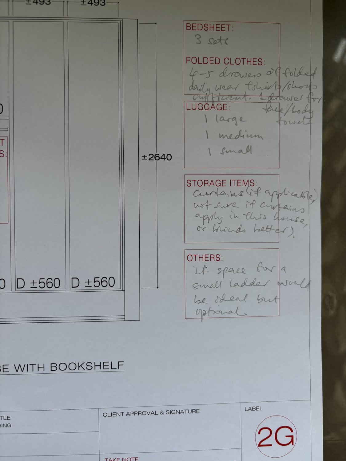 A wardrobe drawing marked up in red pen by the client